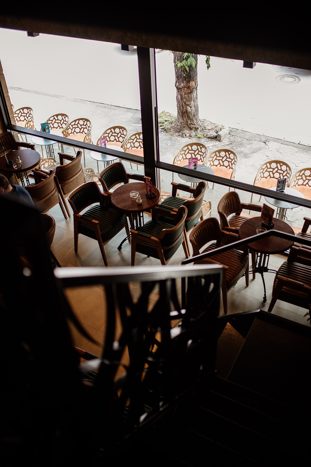 Café seating beside large windows