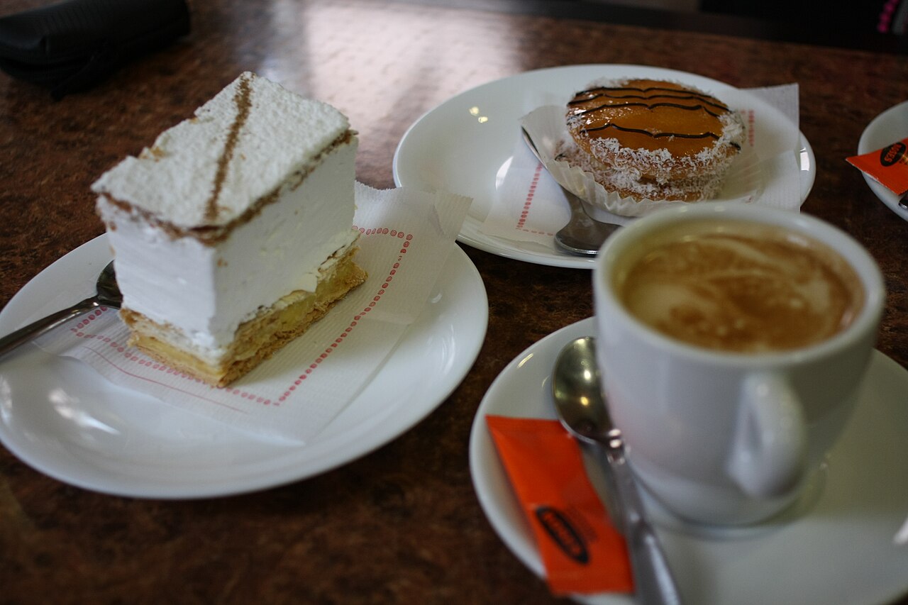 Coffee and pastries on a café table